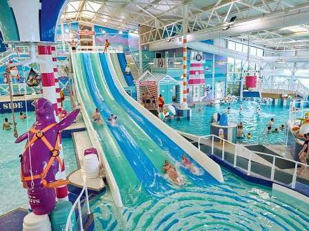 Swimming pool and slides at Haven Hafan Y Mor