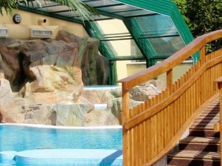 Tropical themed swimming pool at John Fowler Cardigan Bay Holiday Park