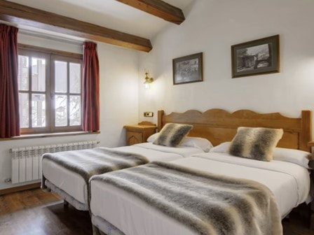 Bedroom at Neilson Chalet Hotel Casale in El Tarter in Andorra 