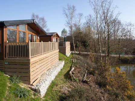 Lodge overlooking lake at Parkdean Resorts Warmwell Holiday Park